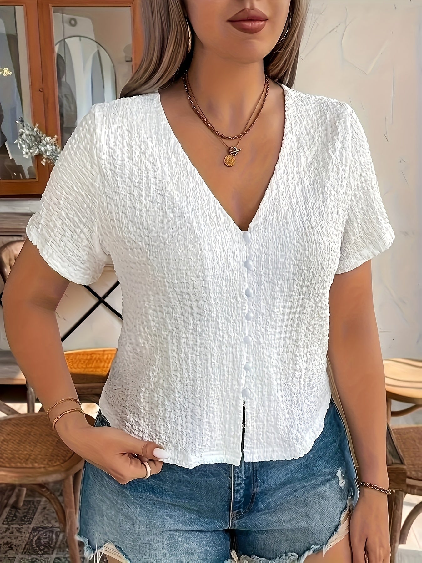 Women's Sleeveless Black V-Neck Top with Front Button Closure