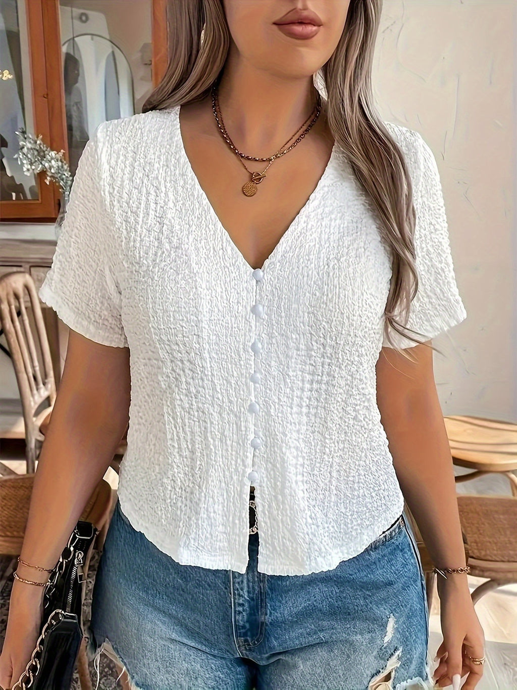 Women's Sleeveless Black V-Neck Top with Front Button Closure