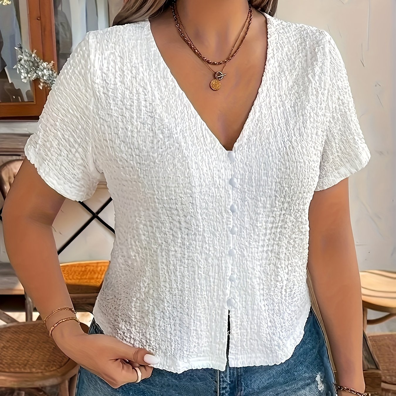 Women's Sleeveless Black V-Neck Top with Front Button Closure