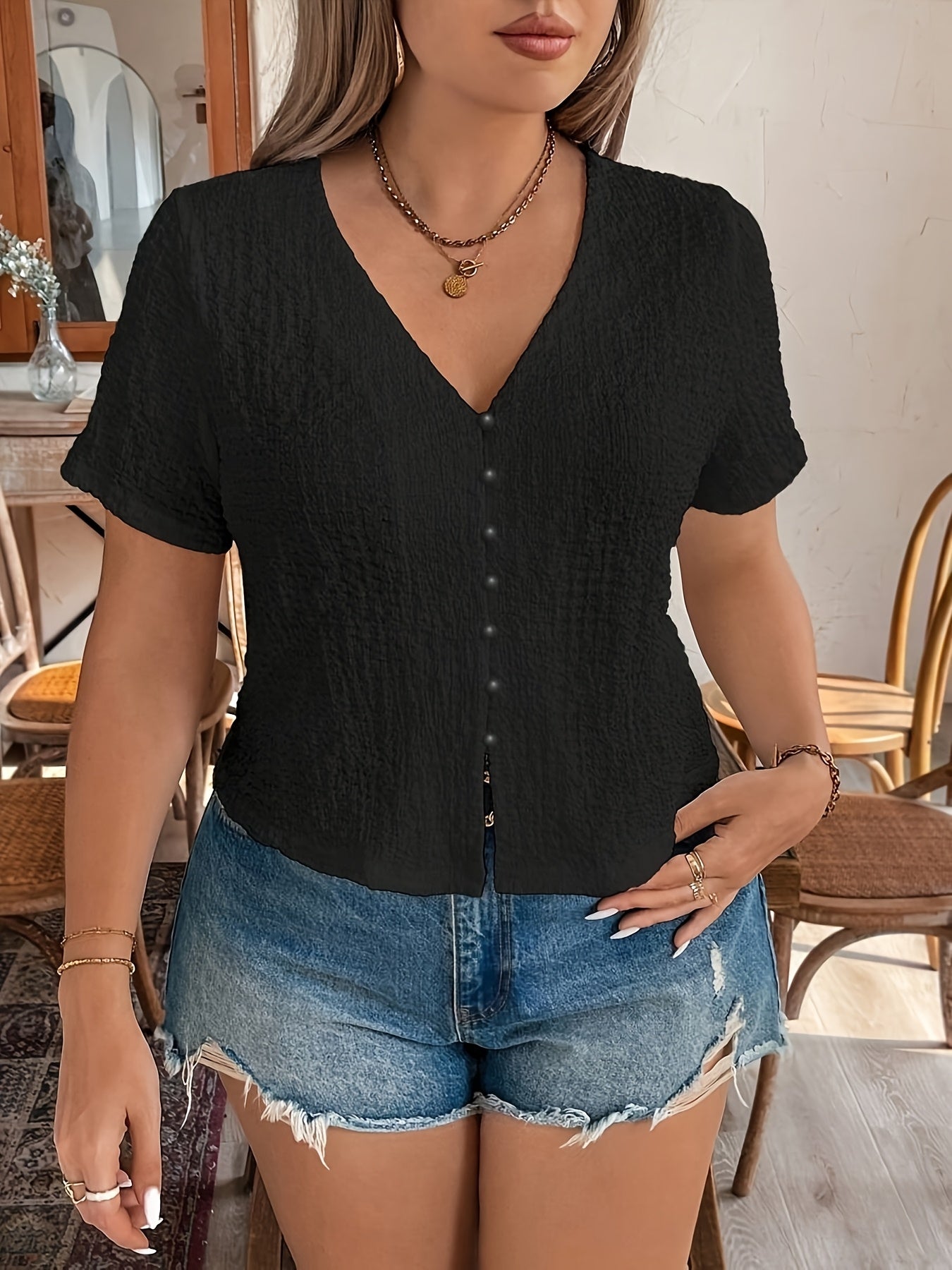 Women's Sleeveless Black V-Neck Top with Front Button Closure