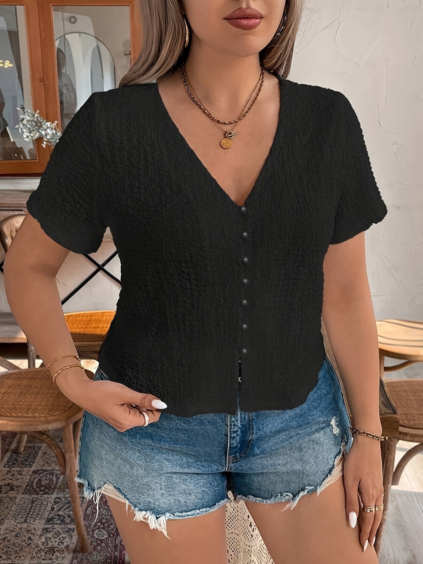 Women's Sleeveless Black V-Neck Top with Front Button Closure