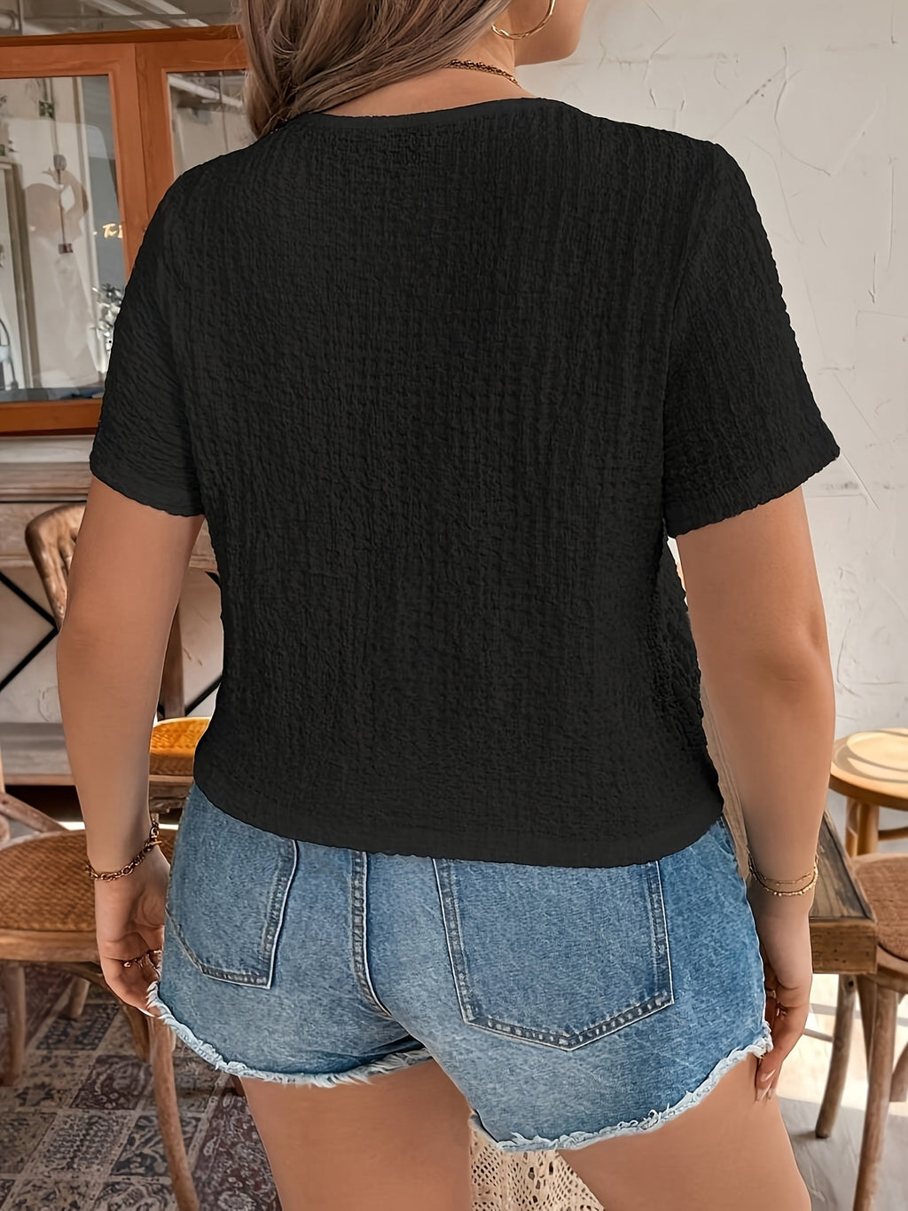 Women's Sleeveless Black V-Neck Top with Front Button Closure