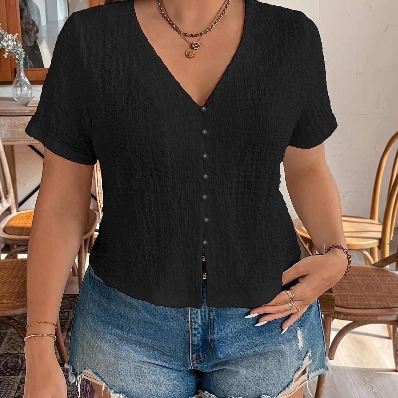 Women's Sleeveless Black V-Neck Top with Front Button Closure